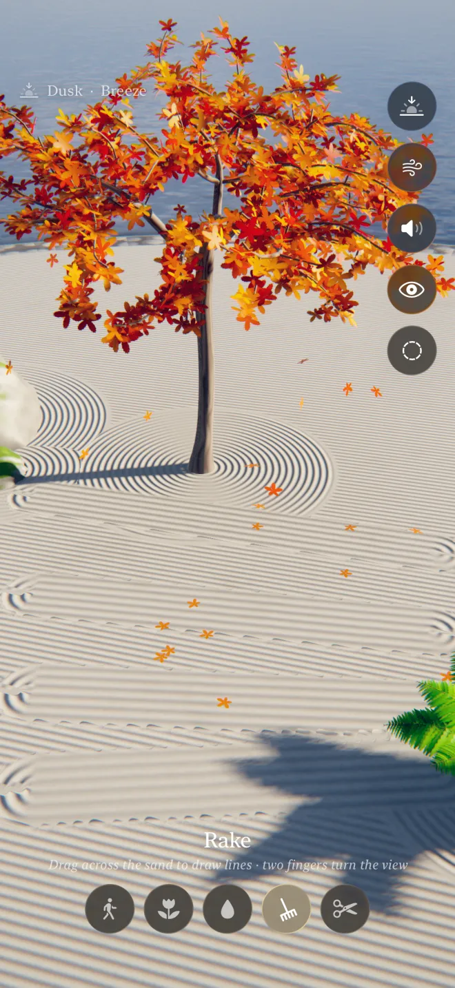 The rake tool: long hand-drawn lines across the sand in the afternoon light, beside a red maple dropping its leaves.